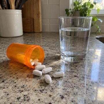 Anti-inflammatory tablets spilled from a pill bottle